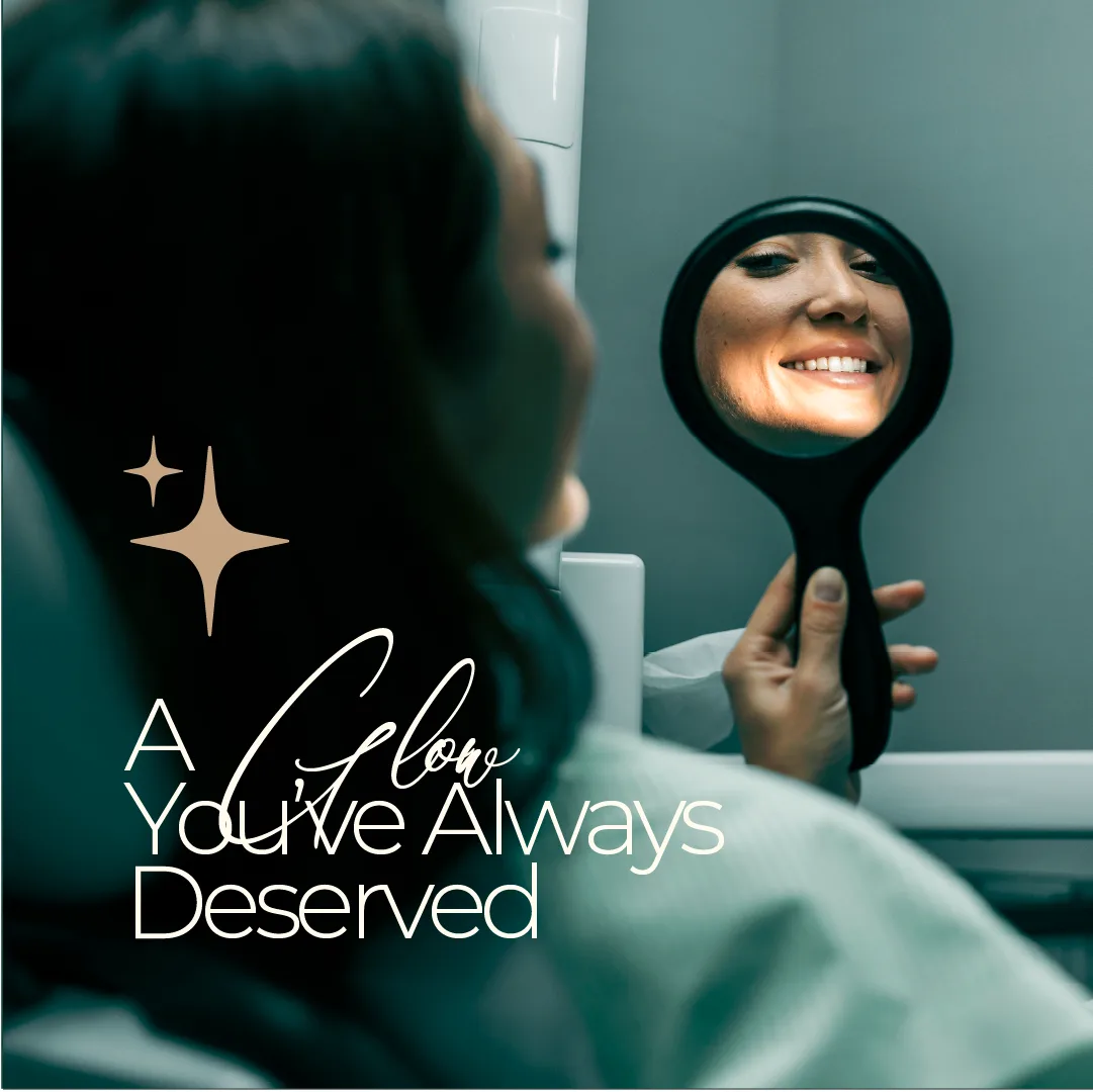'A glow you've always deserved' — a patient checking her smile in a hand mirror